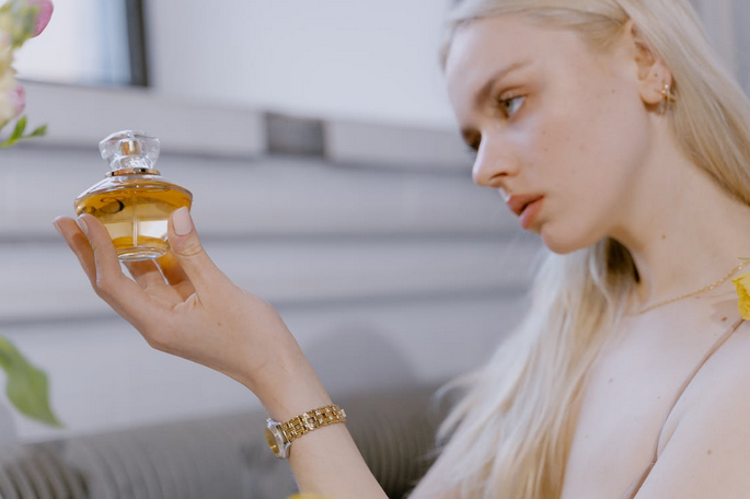 spraying perfume